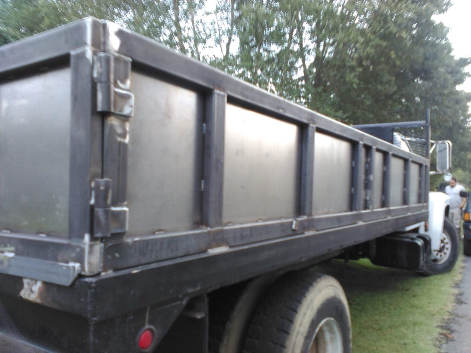 Custom steel flatbed and dump body side panels built on a customer truck